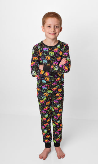 Boy wearing bamboo pajamas for toddlers and kids in Halloween Pumpkins print