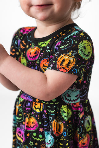 Bamboo bodysuit dress for babies and toddlers in glowing neon Halloween Pumpkins print 
