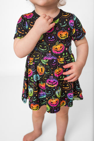 Bamboo bodysuit dress for babies and toddlers in glowing neon Halloween Pumpkins print 