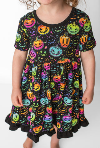 Bamboo ruffle dress for toddlers and kids in glowing neon Halloween Pumpkins print 