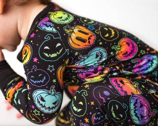 Bamboo zipper pajamas for babies and toddlers in glowing neon Halloween Pumpkins print 